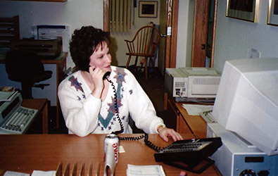 Judy on phone in office